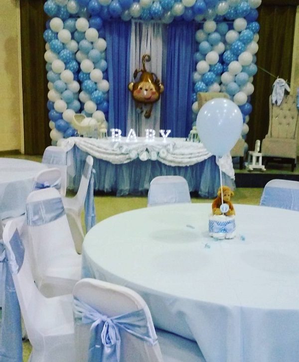 pastel blue boy baby shower monkey theme setup