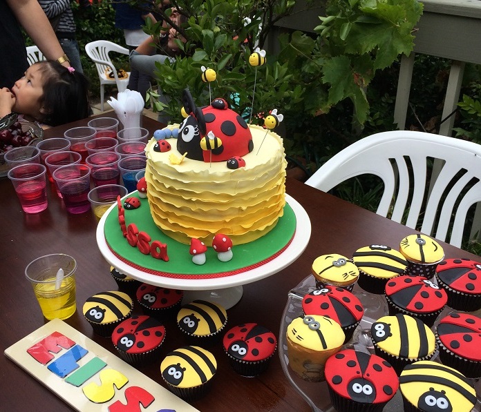ladybug and yellow ruffle cake