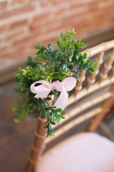 French inspired Sprinkle Baby Shower emerald green and ribbon decor on gold chairs