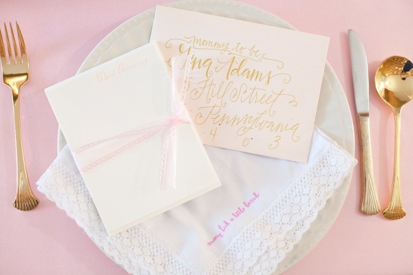 French inspired Sprinkle Baby Shower gold cutlery and lace napkins, white plates and handmade cards