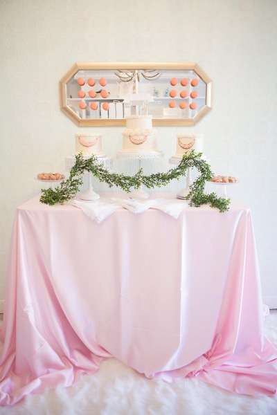 French inspired Sprinkle Baby Shower cake buffet table on pastel pink table cover