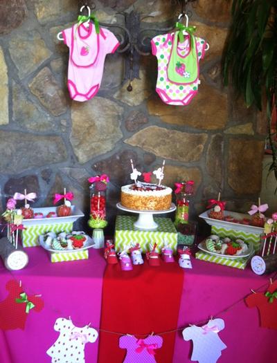 strawberry themed baby shower party ideas by maria via babyshowerideas4u dessert table featuring strawberry clothes and bibs