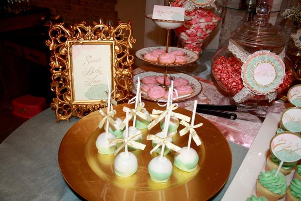 vintage glam baby shower via babyshowerideas4u, desserts, gold frames, elegant cake pops with ribbons