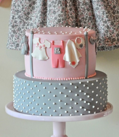 pink and grey girl onesie cake