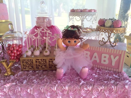 pink and gold baby shower decorations and sweets