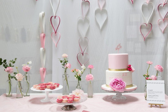 Sweet XOXO Baby Shower dessert table with cake in pink