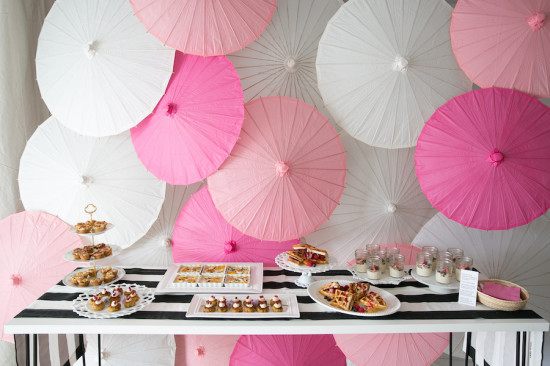 Sweet XOXO Baby Shower food table with parasol backdrop