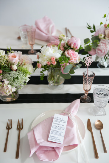Sweet XOXO Baby Shower guest table setting with florals