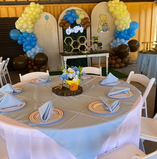 pastel pooh baby shower guest table
