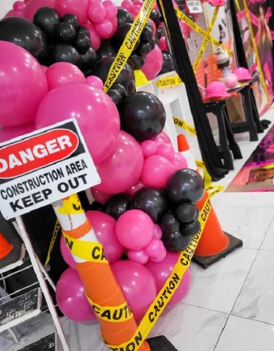 pink construction baby shower balloon garland