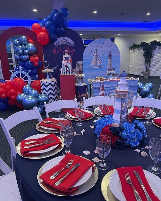 red and navy nautical baby shower table setup