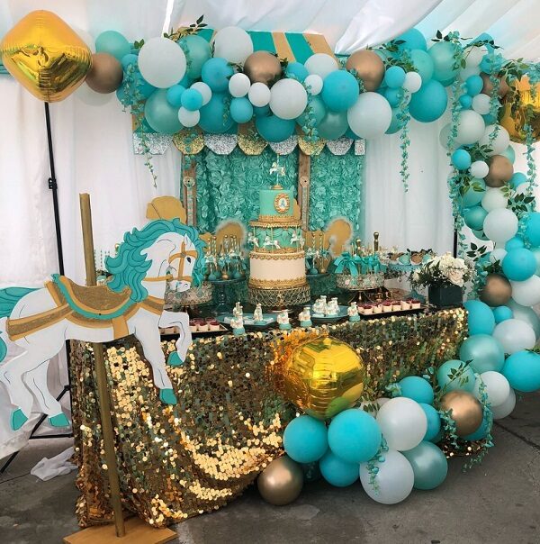 teal carousel party decorations and balloon garland