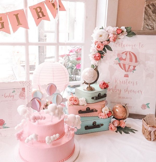 pretty in pink travel themed baby shower decors