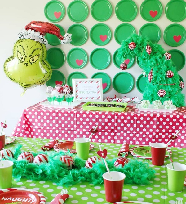 The grinch green paper plates as party decor backdrop
