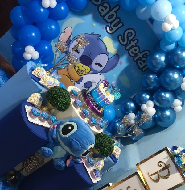 baby stitch backdrop and balloon garland
