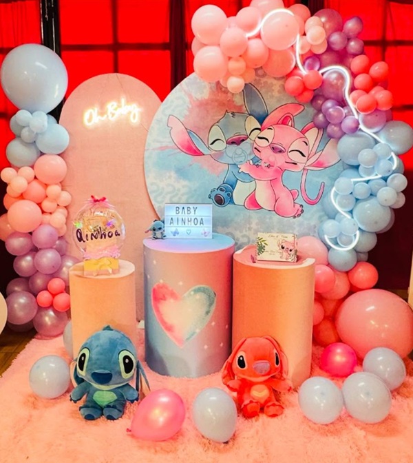 stitch and angel baby shower backdrop setup