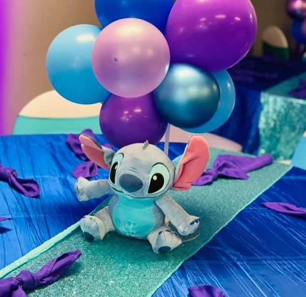 stitch soft toy and balloon centerpiece