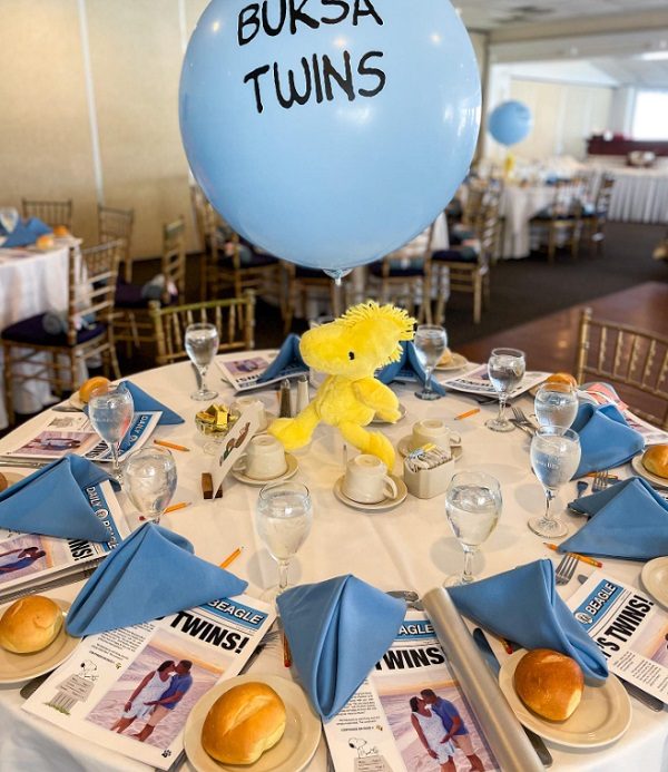twins snoopy themed baby shower table setup