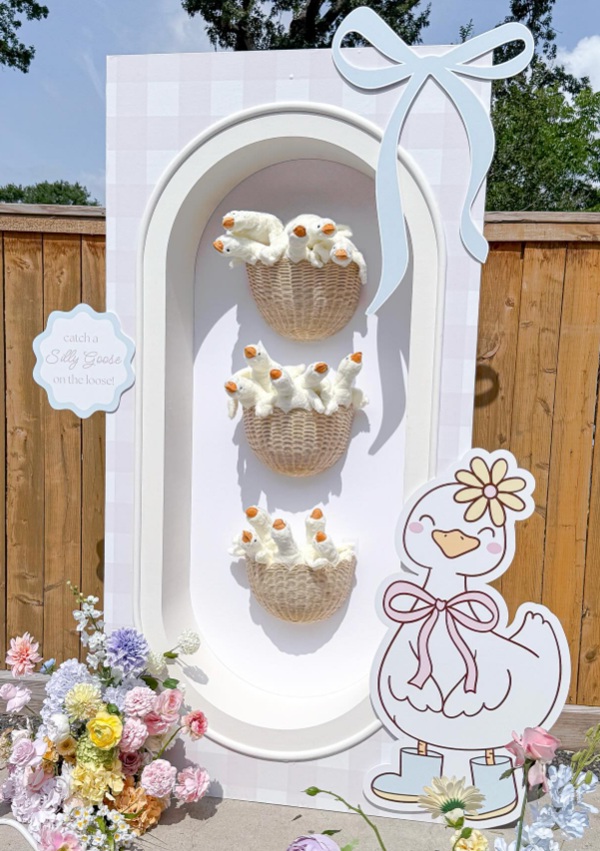 whimsical goose baby shower setup