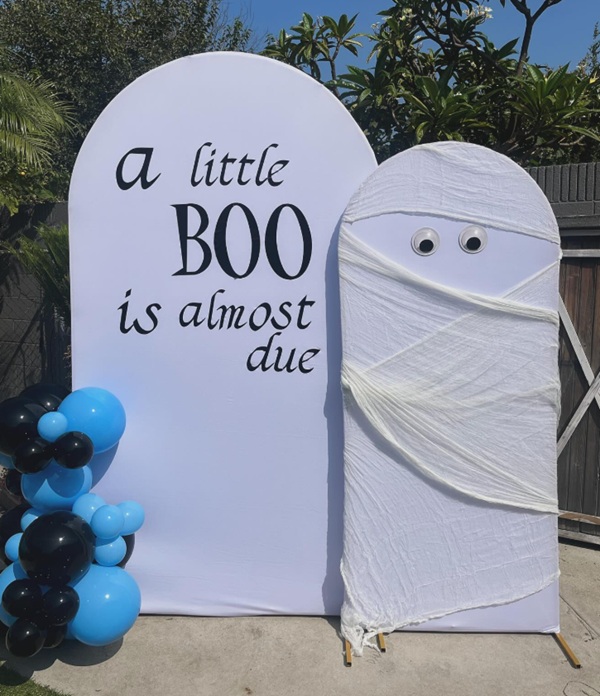 simple Halloween themed backdrop for a baby shower