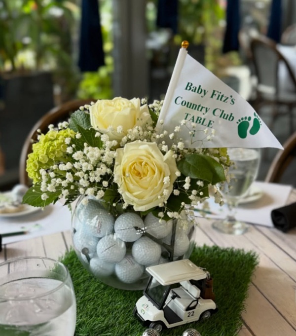 golf themed baby shower complete with putting flags for table numbers