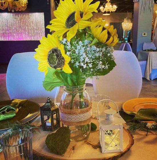 giant sunflower arrangement in rustic burlap vase