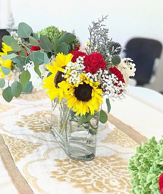 sunflower in clear glass table centerpiece